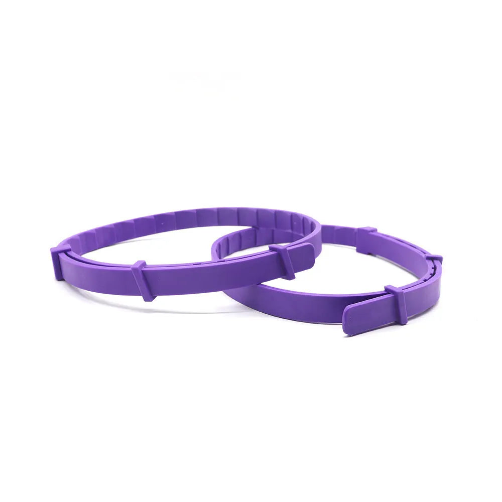 Pack of four solid colour TPR dog anxiety relief collars in Chinese style, laid flat.