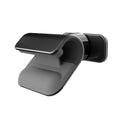 Black gravity car phone holder with 360-degree rotating head mounted on a car dashboard