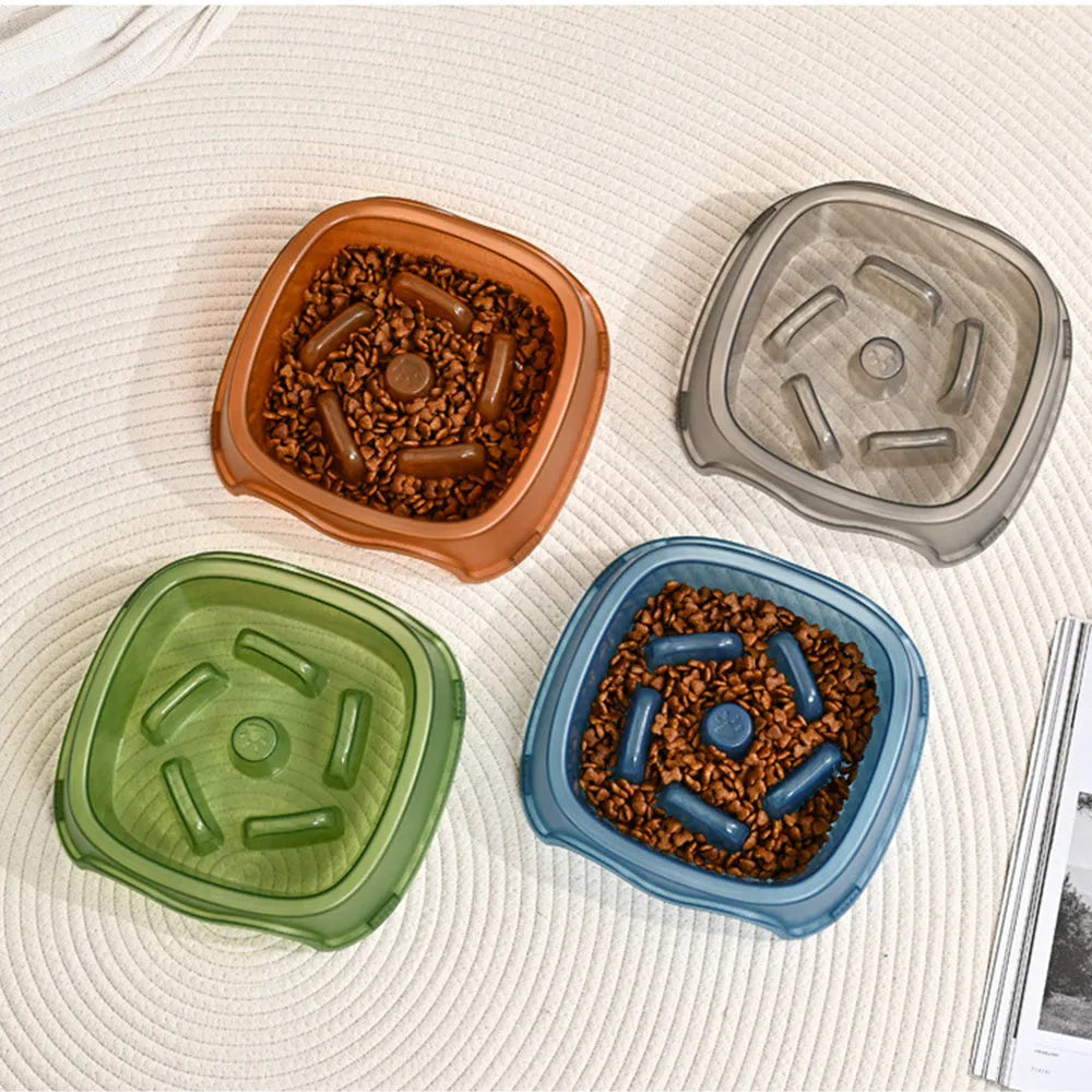 Blue plastic slow feeder dog bowl with anti-choking design on a white background