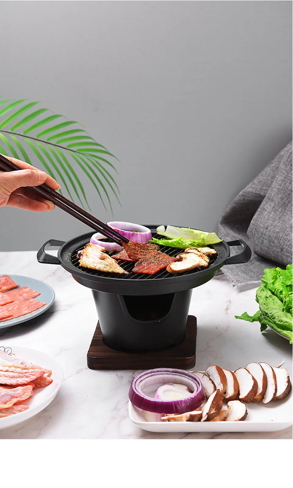 Mini BBQ grill alcohol stove with double-head flame and non-stick plate on tabletop