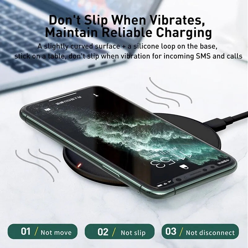 Black wireless charging pad with textured surface and indicator light for mobile phones