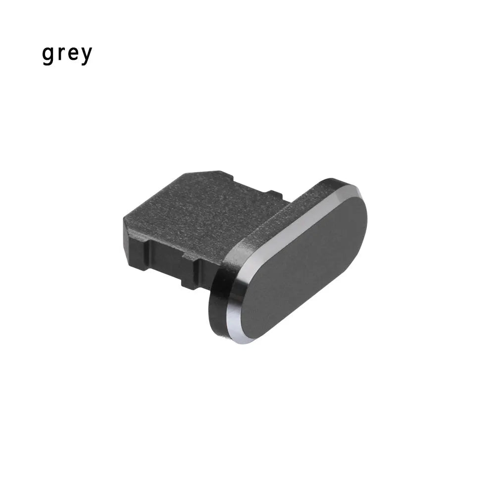 Aluminium alloy dust plug for iPhone charging port in various colours including gold, silver, blue, and rose gold.