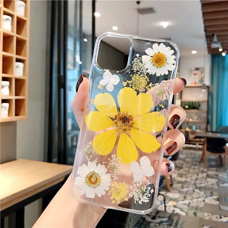 Pink and yellow floral print TPU back cover case for iPhone on a white background.