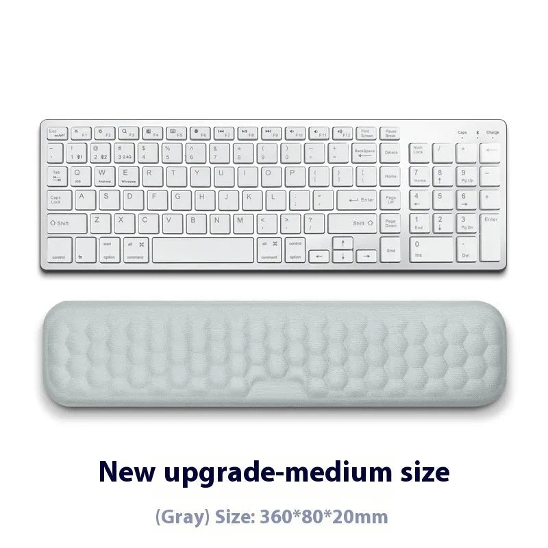 Grey and black memory foam mouse wrist pads with silicone bases, shown in cloth and leather cover options.