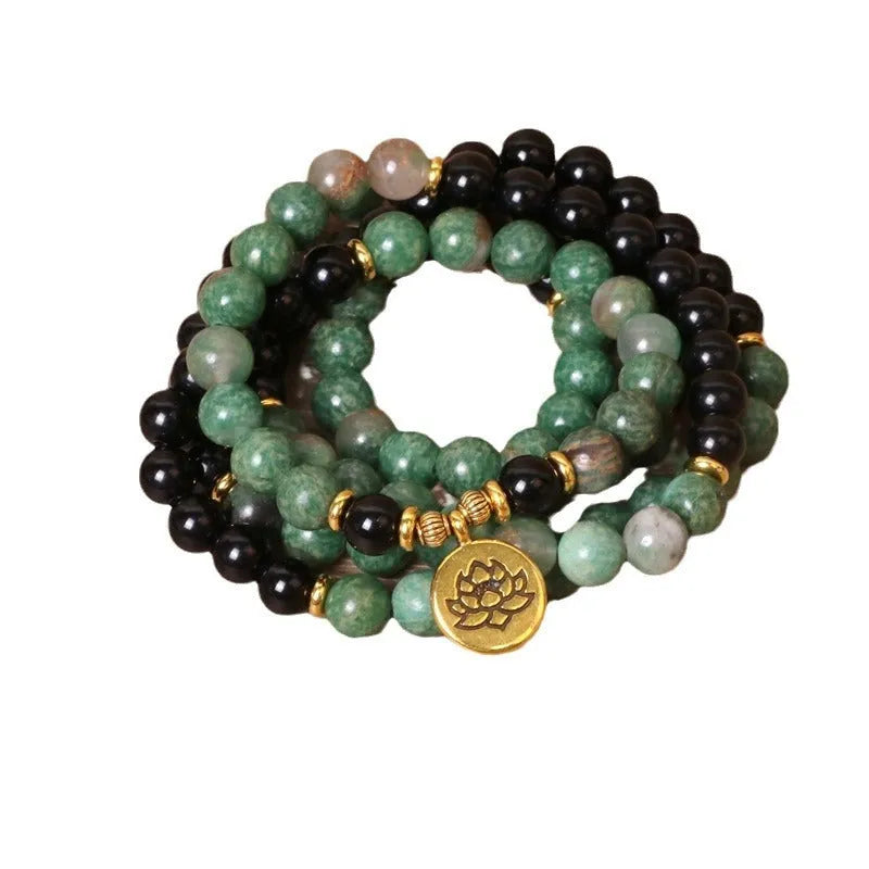 Green and black elastic beaded long bracelet made from alloy material.