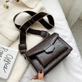 Vintage-style black PU leather crossbody bag with adjustable strap