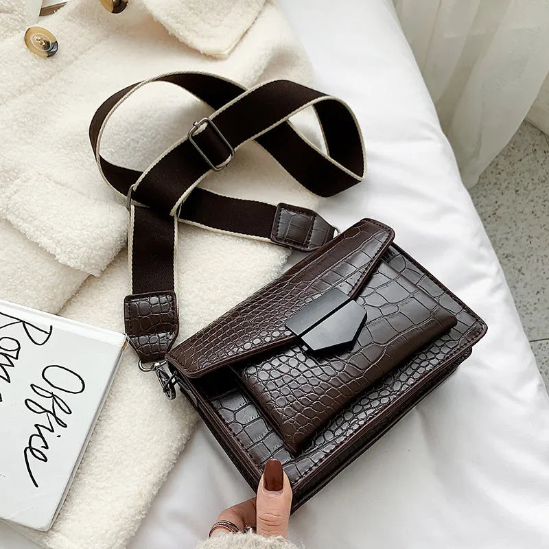 Vintage-style black PU leather crossbody bag with adjustable strap