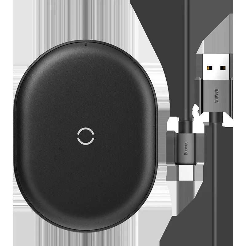 Black wireless charging pad with textured surface and indicator light for mobile phones