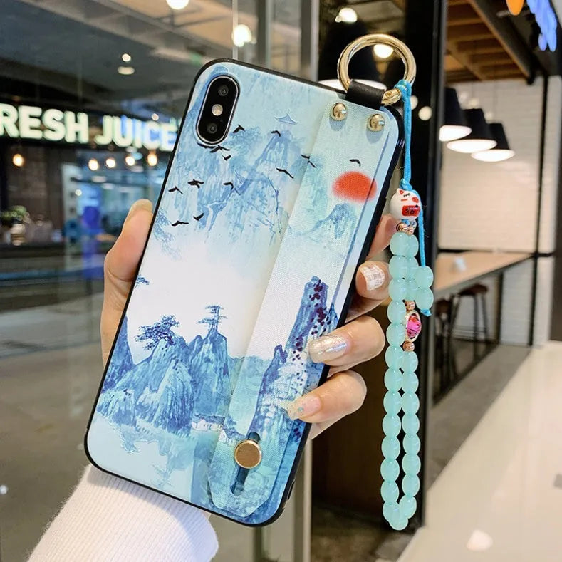 Rose flower patterned iPhone case with integrated wrist strap attachment for Apple smartphones