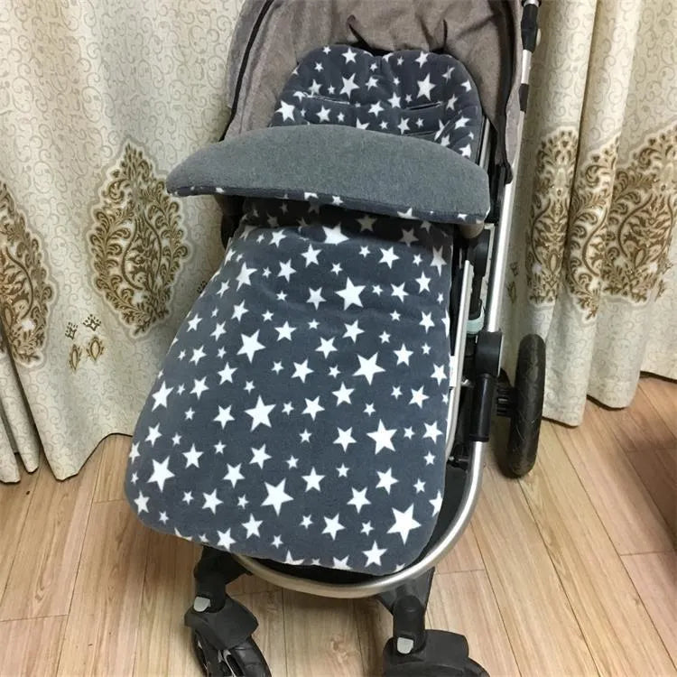 Envelope-style baby stroller sleeping bag in a choice of colours with cotton wool filling.