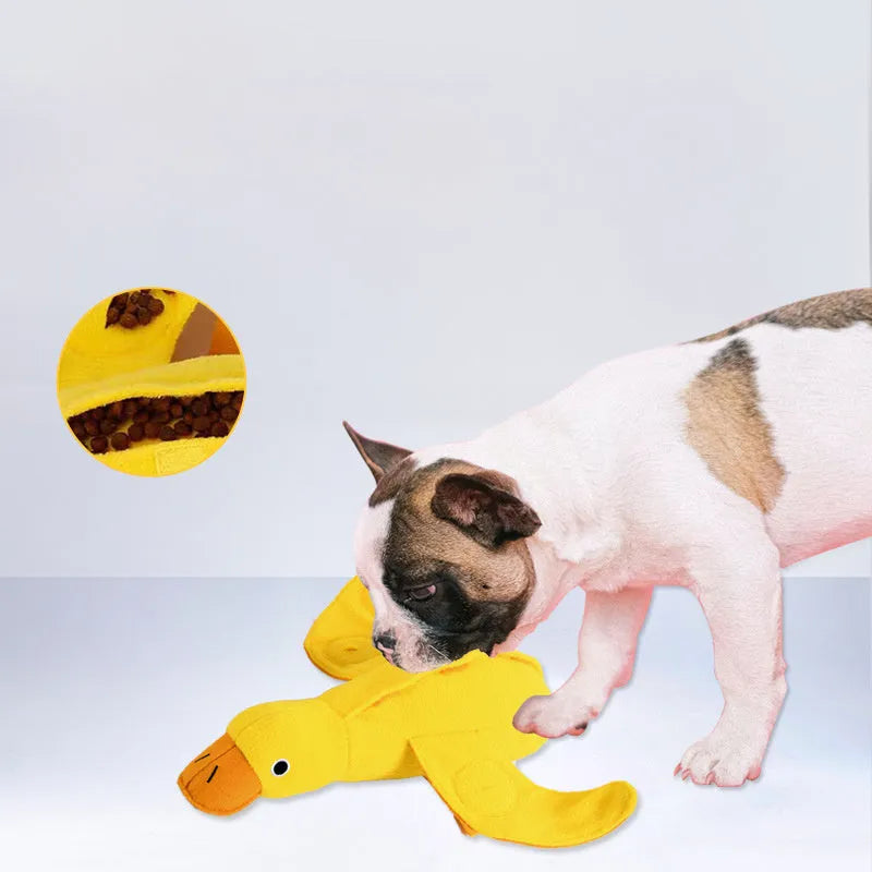 Yellow plush teddy dog toy with internal squeaky duck for training and food leak feature