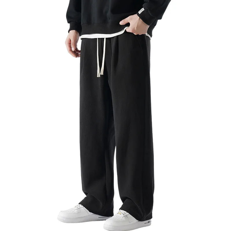 Men's apricot double-sided polar fleece trousers with a wool lining, shown with a drawstring waist.
