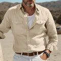 Men's long-sleeved loose fit shirt in a cotton linen blend, shown in solid green colour.