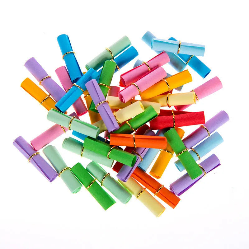 Multi-coloured mini paper scrolls in various sizes with metal eyelets for hanging.
