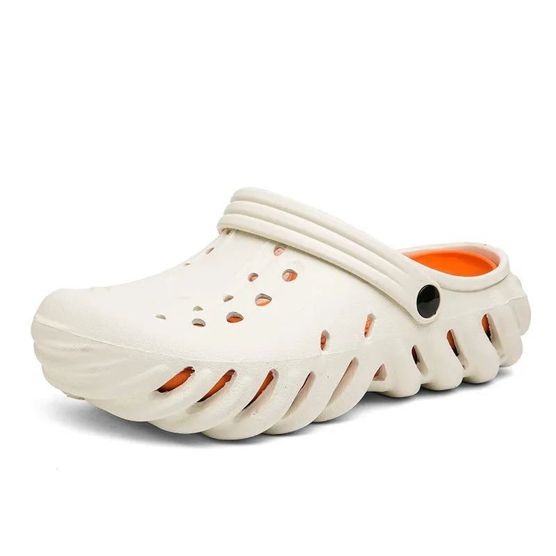 Men's beige EVA slipper sandals with hollow-out design and non-slip sole, shown on a wooden deck.