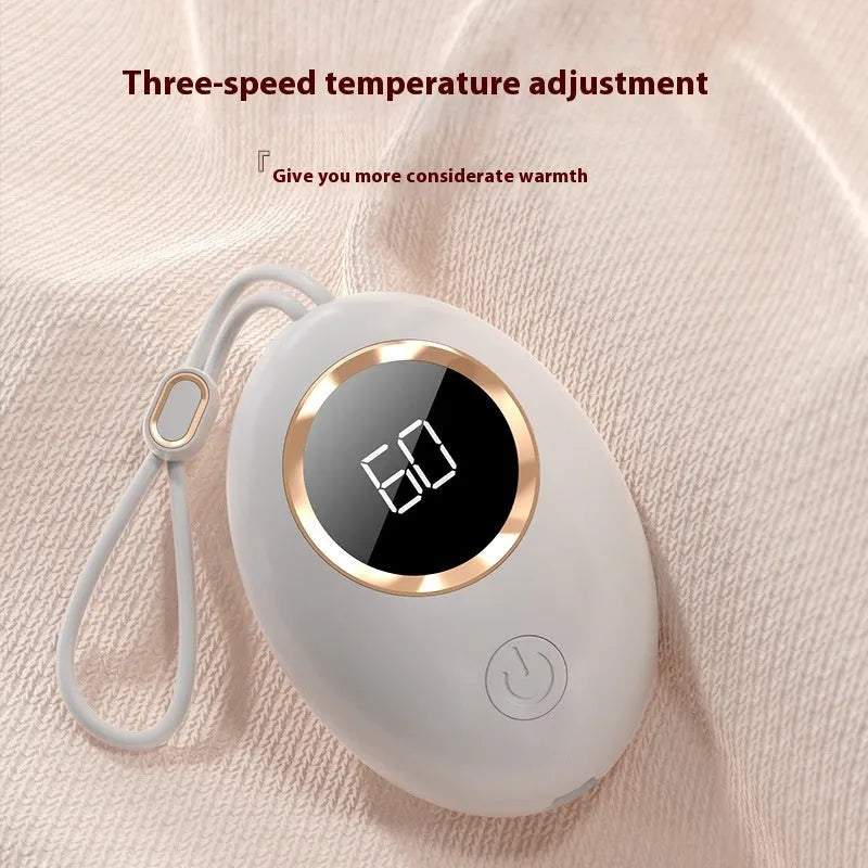 USB digital display hand warmer power bank in pink, showing aluminium heating plate