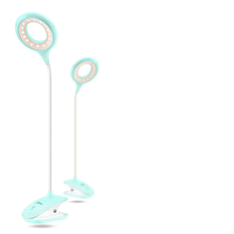 Green, pink and white USB rechargeable touch control table lamps on a wooden surface