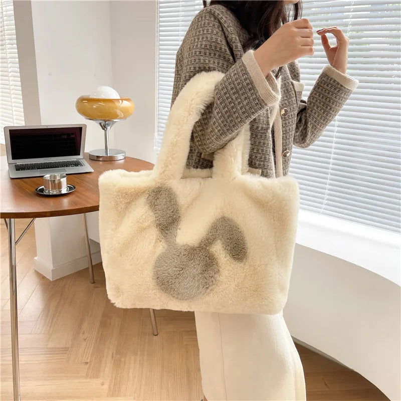 Cute cartoon rabbit ears plush shoulder tote bag in a solid colour.