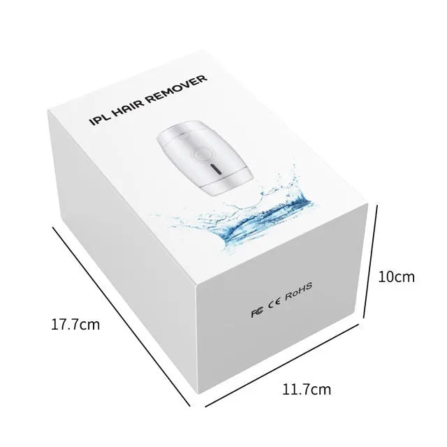 White home IPL laser hair removal device on a table showing its compact size and control buttons.