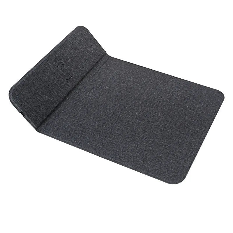 A grey foldable cloth phone holder open as a stand, with a smartphone charging on it.