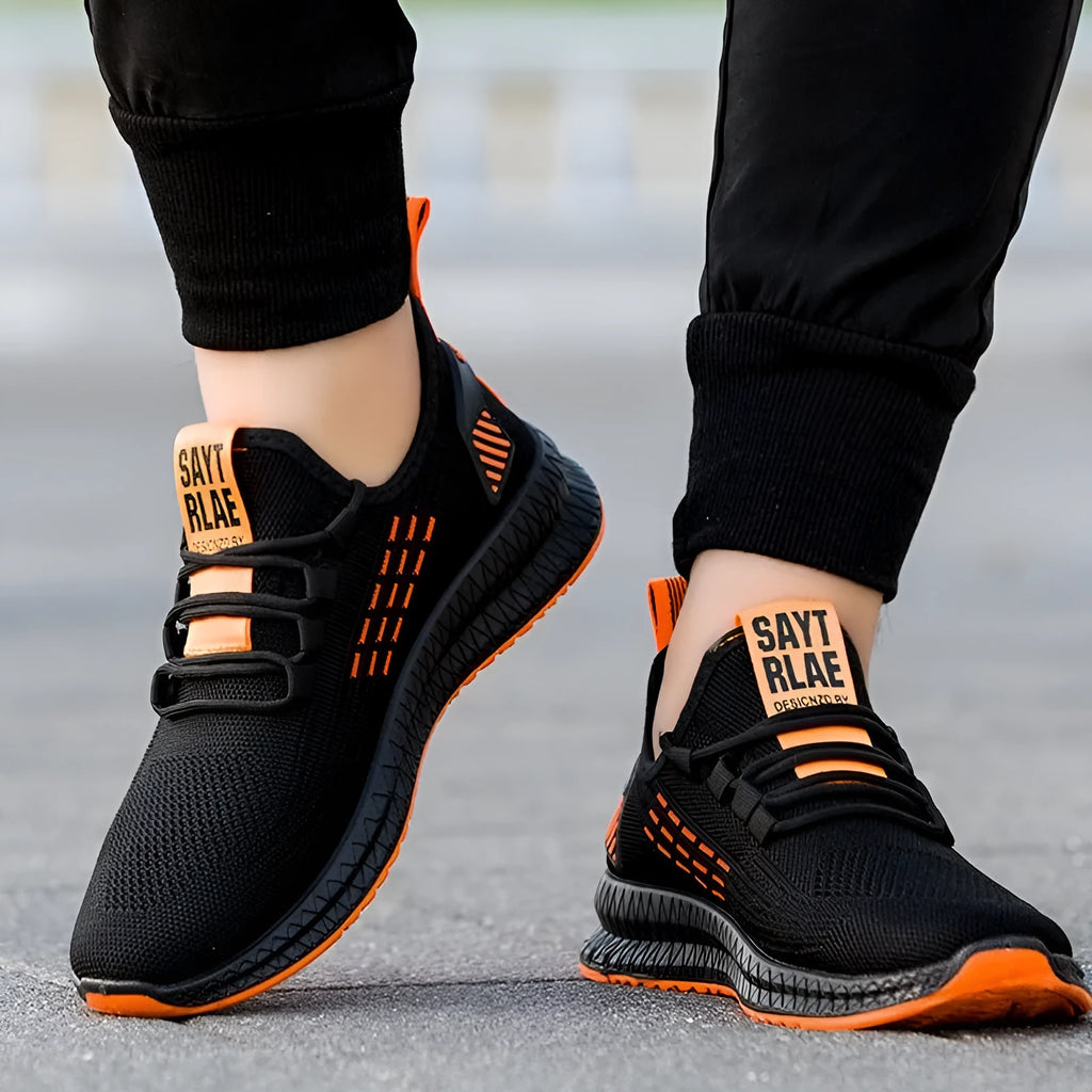 Men's casual trainers with Flying Weave upper, cross straps, and round toe design in multiple colour options
