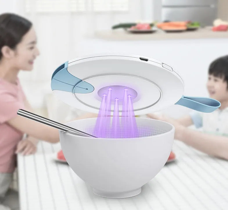 Portable UV baby bottle steriliser in blue or pink, showing compact size and USB port.