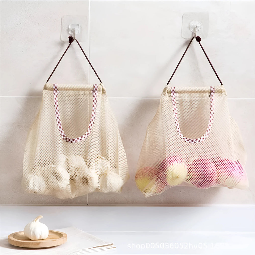 Beige plaid polyester mesh kitchen storage bag with cotton rope loops on a wall hook, 26x29cm
