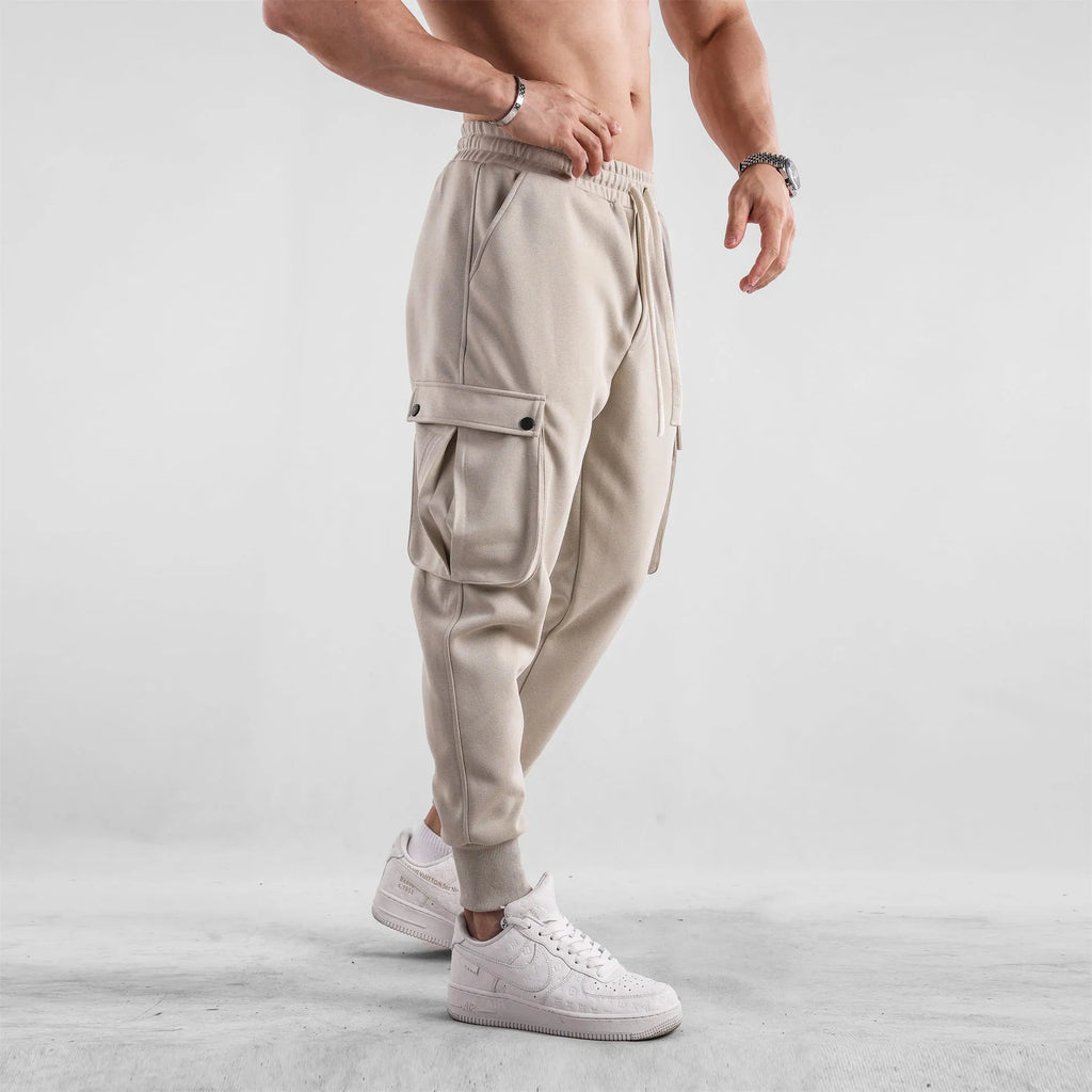 Men's loose cotton sports trousers with ankle ties and multiple pockets in various colour options