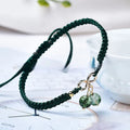 Women's natural strawberry quartz crystal bracelet with cherry charm on adjustable beaded band