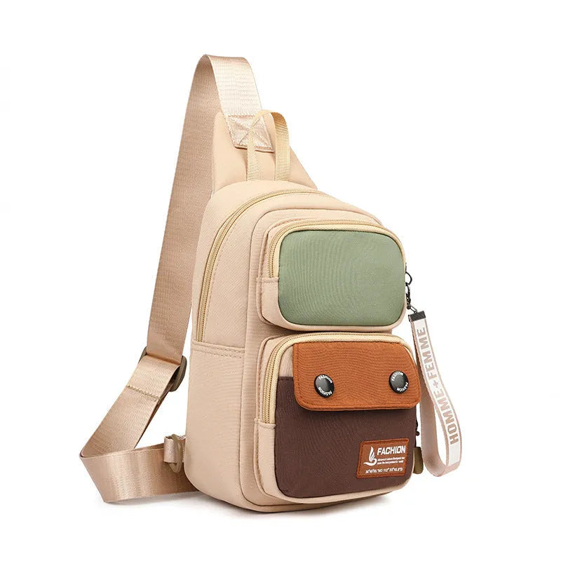 Black nylon crossbody bag with contrast colour accents and a polyester lining.
