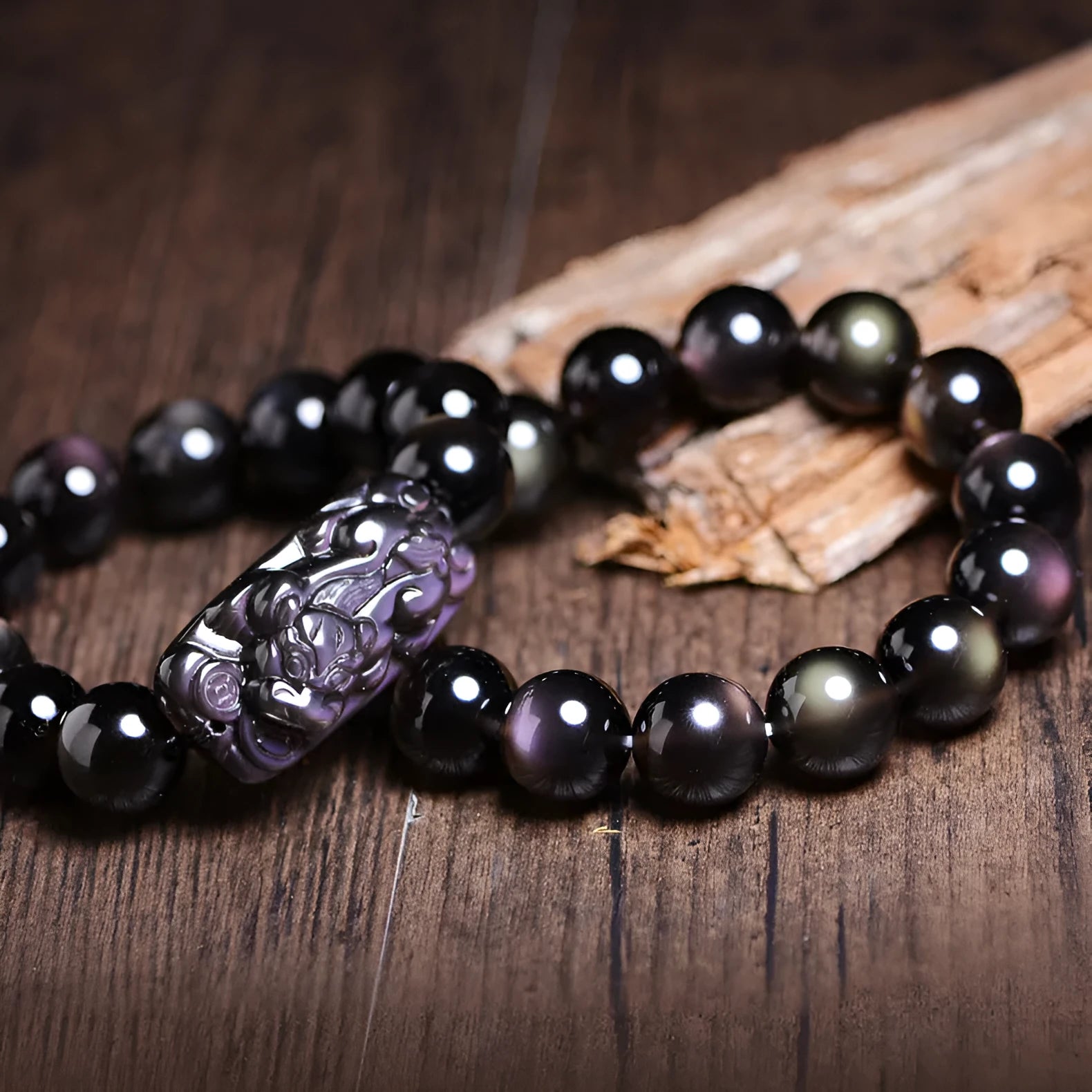 Natural icy obsidian Pi Xiu bracelet with double-eye ice stone colour on a geometric bead design.