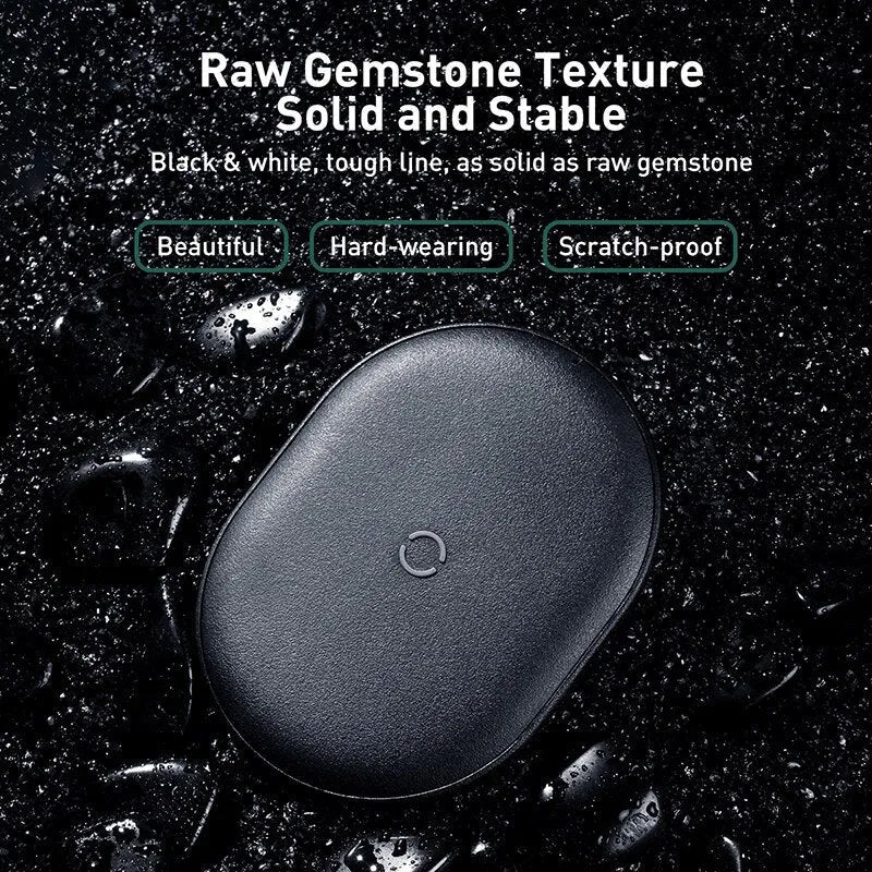 Black wireless charging pad with textured surface and indicator light for mobile phones
