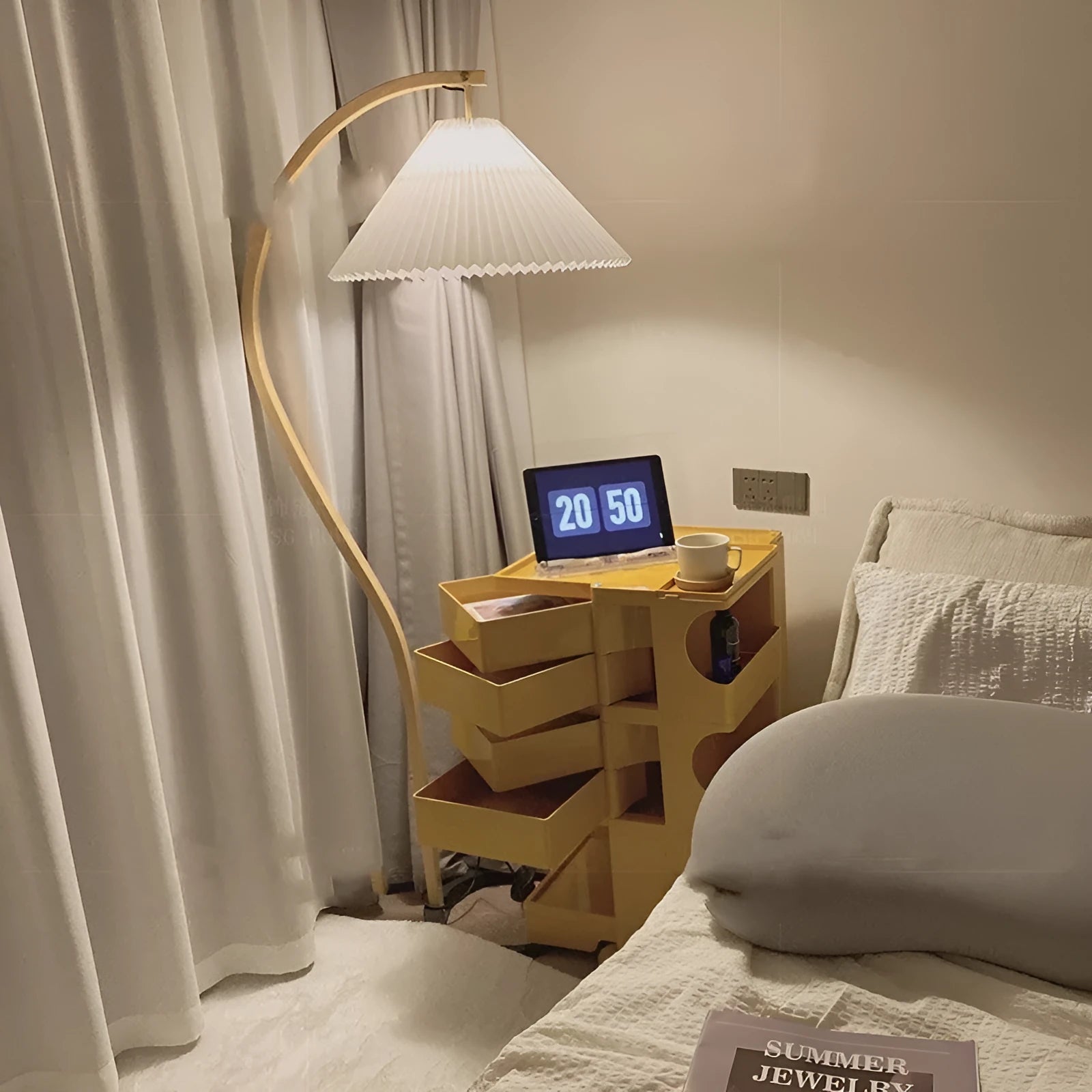 Vertical retro floor lamp with wood shade in three-colour variable light beside bed