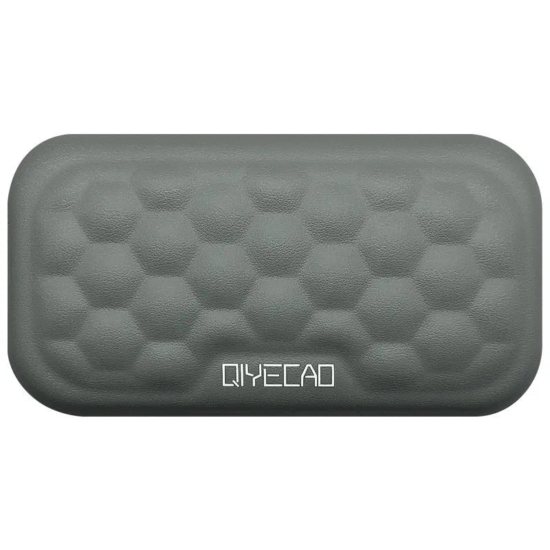 Grey and black memory foam mouse wrist pads with silicone bases, shown in cloth and leather cover options.