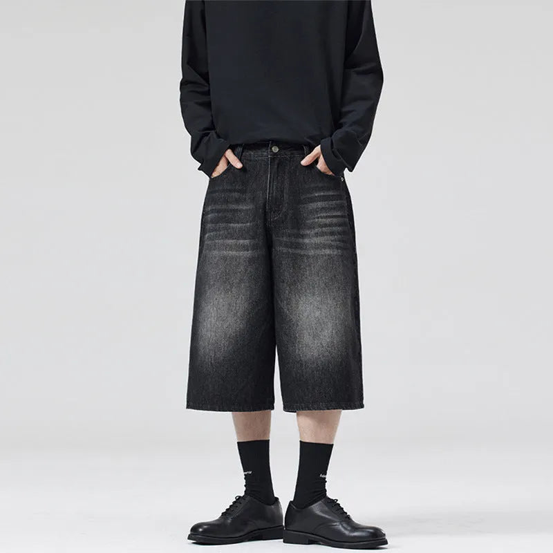 Men's straight leg cropped denim shorts in light blue, shown laid flat.