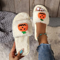 Yellow pumpkin cartoon design open-toe slippers with plush synthetic fur upper.