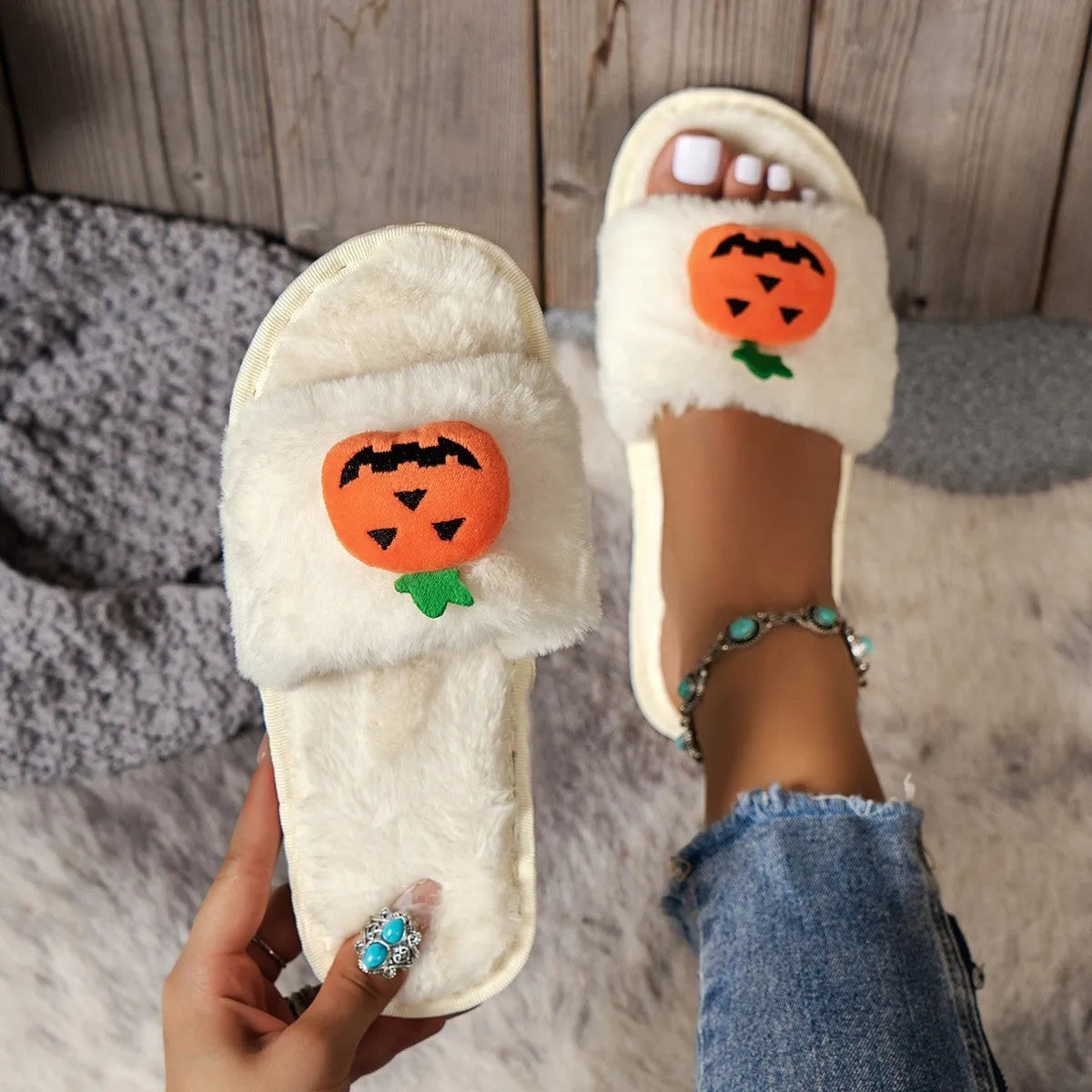 Yellow pumpkin cartoon design open-toe slippers with plush synthetic fur upper.