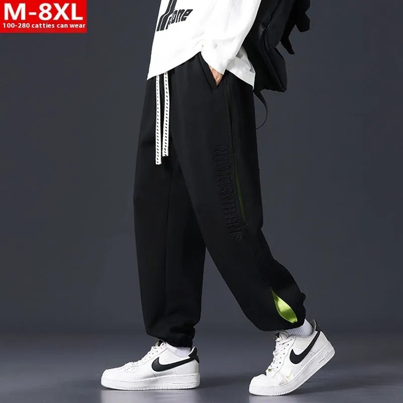 Men's loose fit cotton casual trousers with stitching print design and banded ankle cuffs.