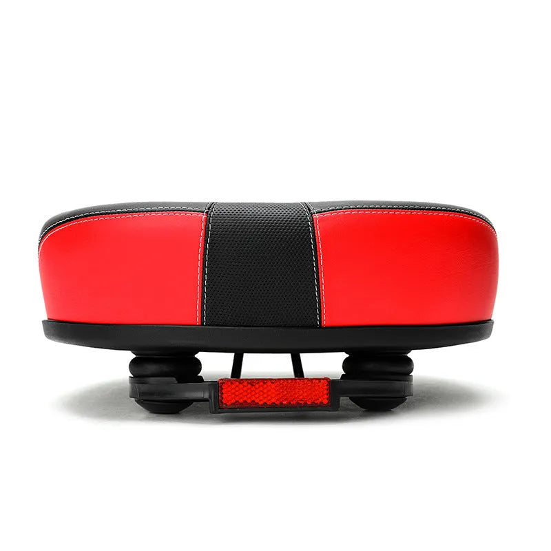 Red mountain bike saddle with thickened cushioning and reflective stickers, showing 210x270mm dimensions