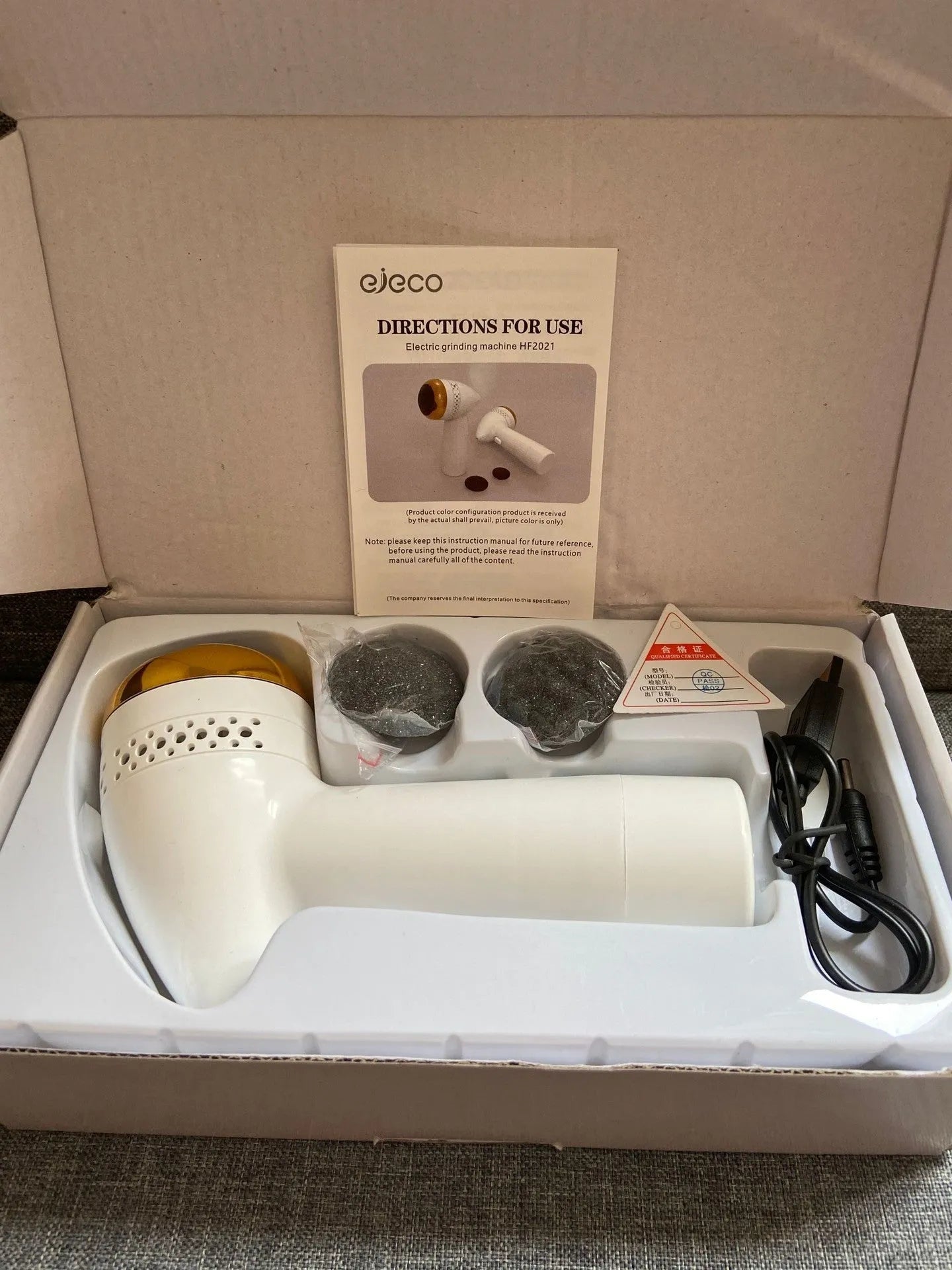 Electric vacuum foot grinder with quartz grinding head in metallic colour options.