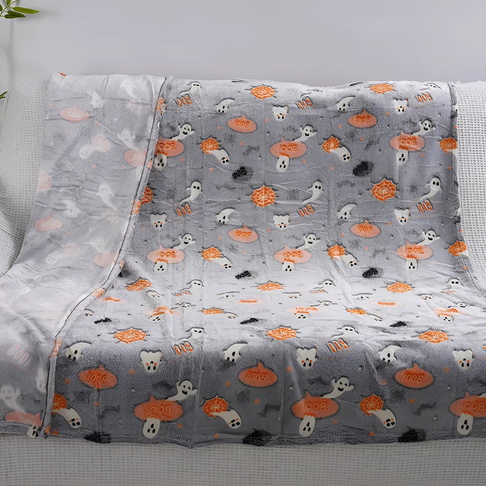 Colourful cartoon-pattern flannel blanket for children, shown in two size options.