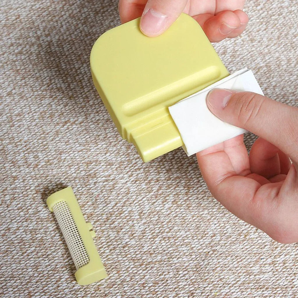 Manual fuzz remover brush with removable catching net for clothes and sofas, compact plastic design