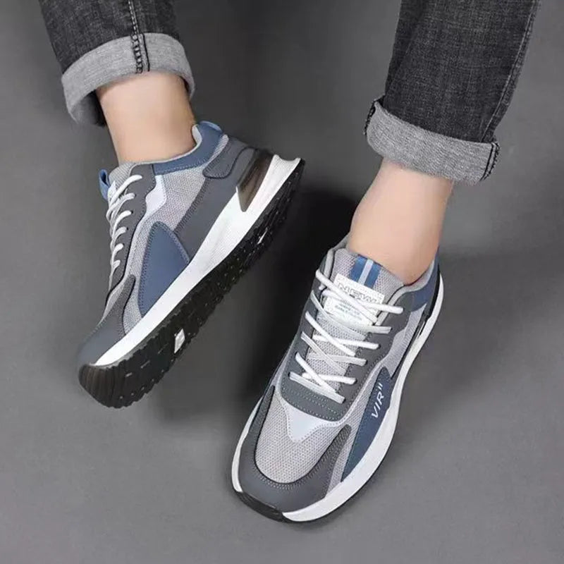 Men's colour block mesh sneakers in black, grey, or white on a plain background