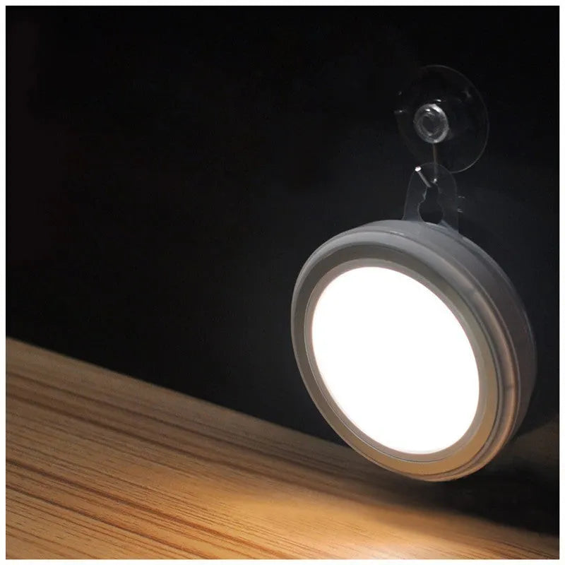 Compact round white motion sensor LED light with infrared sensor for wardrobes and corridors.