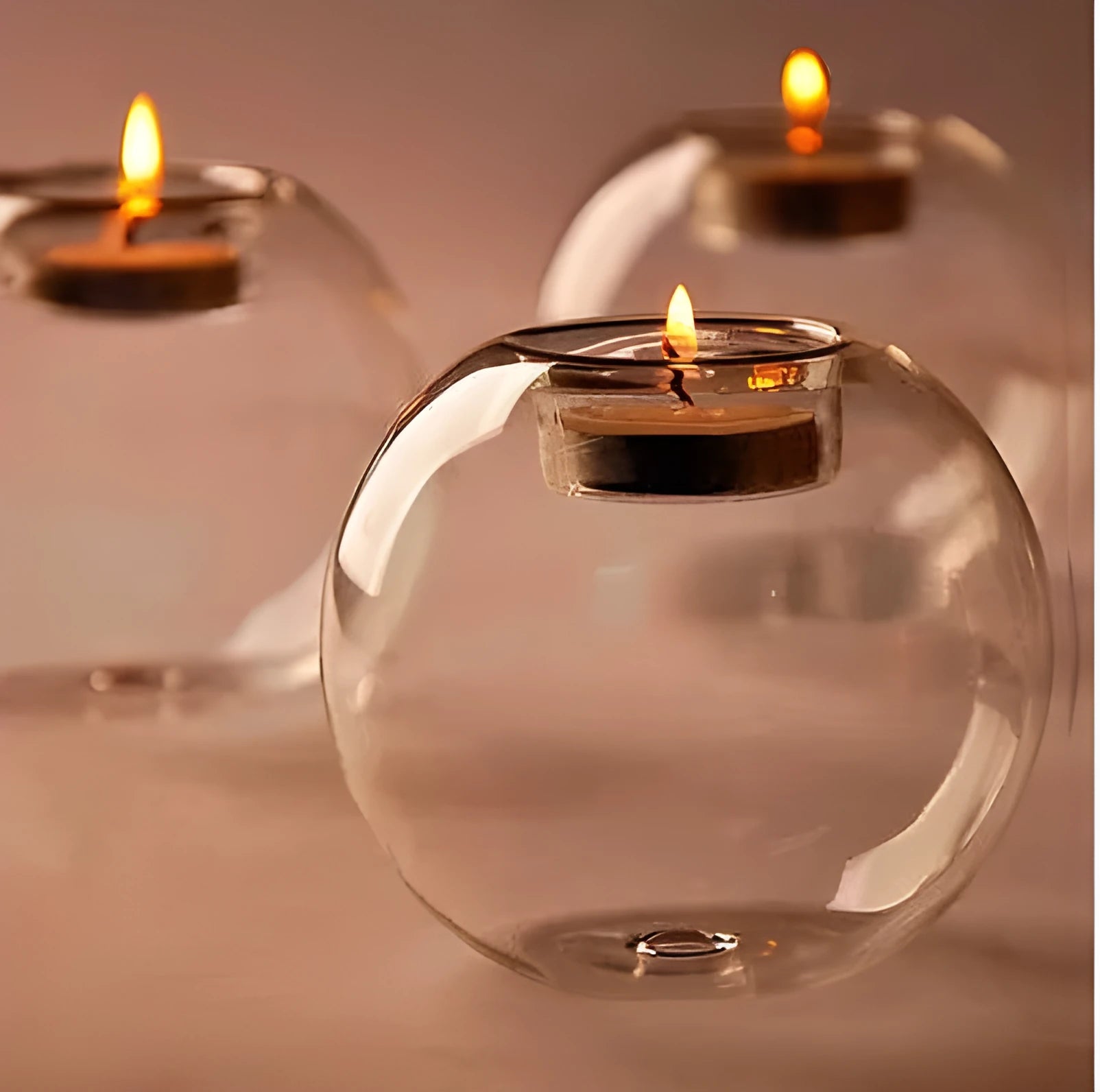 Hand-blown Europe style hollow glass candle holder in round design on table