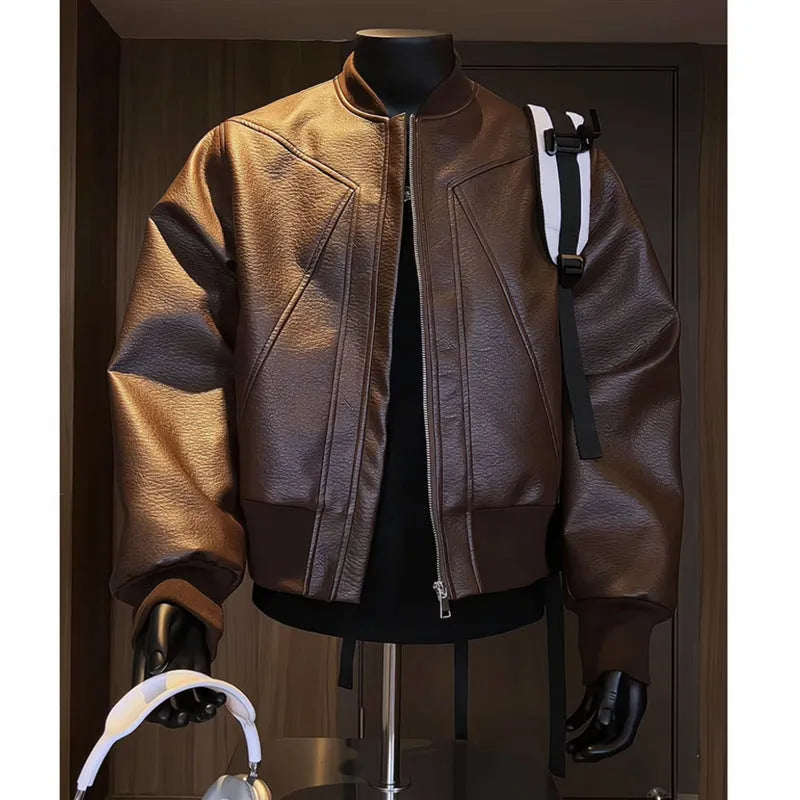 Black extended-length men's PU leather jacket with a litchi texture on a hanger.