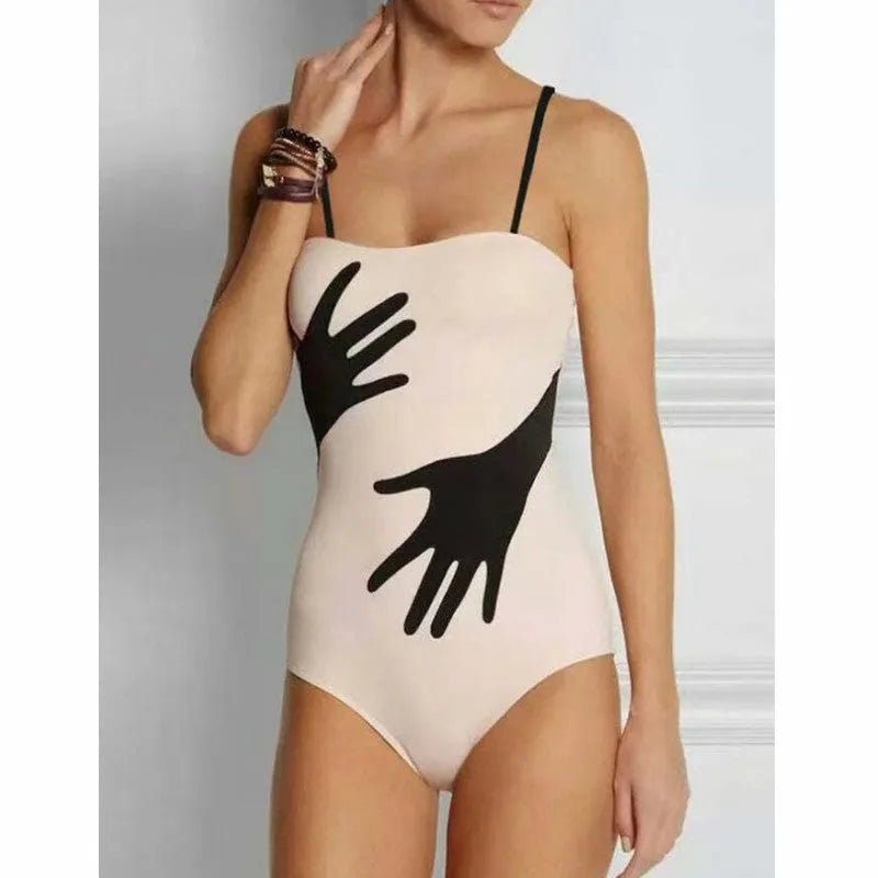 Women's patterned polyester swimsuit with attached tulle skirt in one-piece bikini design