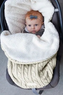 Envelope-style baby stroller sleeping bag in a choice of colours with cotton wool filling.