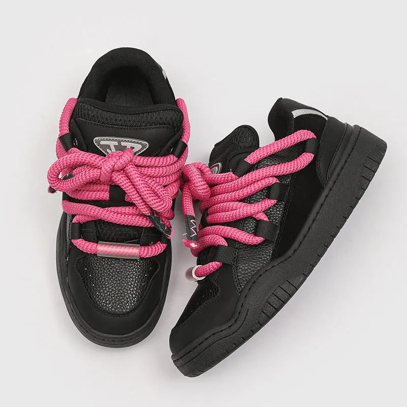 Pair of casual unisex lace-up shoes with thick rubber sole, shown in a choice of colours.