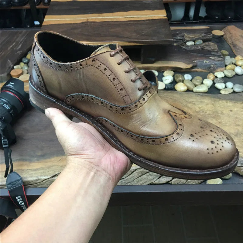Men's light brown vintage leather casual shoes with carved distressed detailing and lace-up closure
